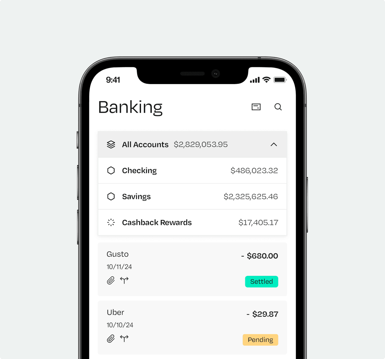 Smartphone displaying a banking app with account balances for checking, savings, and cashback rewards, plus recent transactions from Gusto and Uber.
