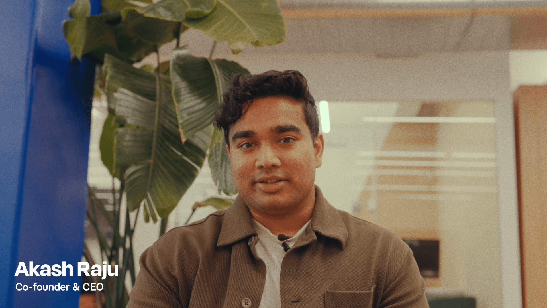 Akash Raju, Glimpse co-founder and CEO, speaking in an office.