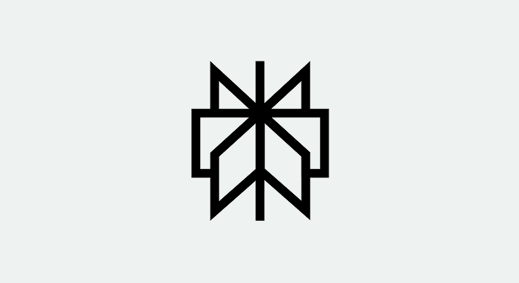 A symmetrical, geometric black logo resembling a stylized butterfly with angular wings on a light gray background.